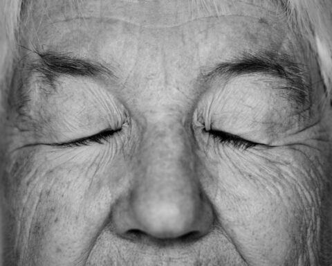 old woman with eyes closed