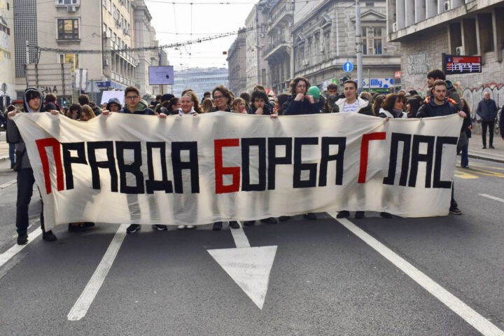 Students hold cloth banner with the slogan “Justice, Struggle, Voice” during the joint demonstration between students and retirees, February 5, 2025.