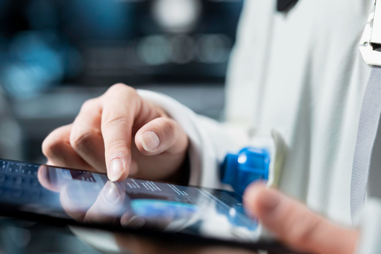 Close up of astronaut reviewing spacecraft metrics on tablet