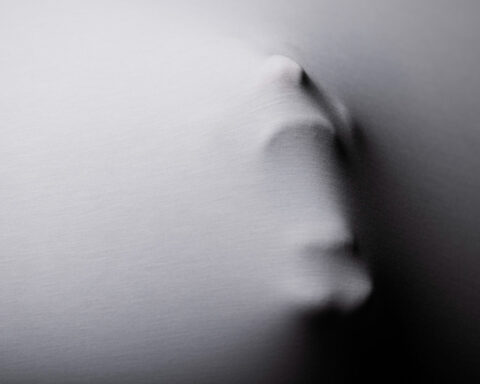 Terrifying screaming adult silhouette in studio