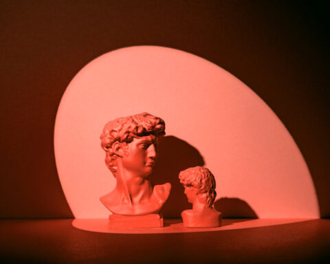 Greek bust in red alluding to love