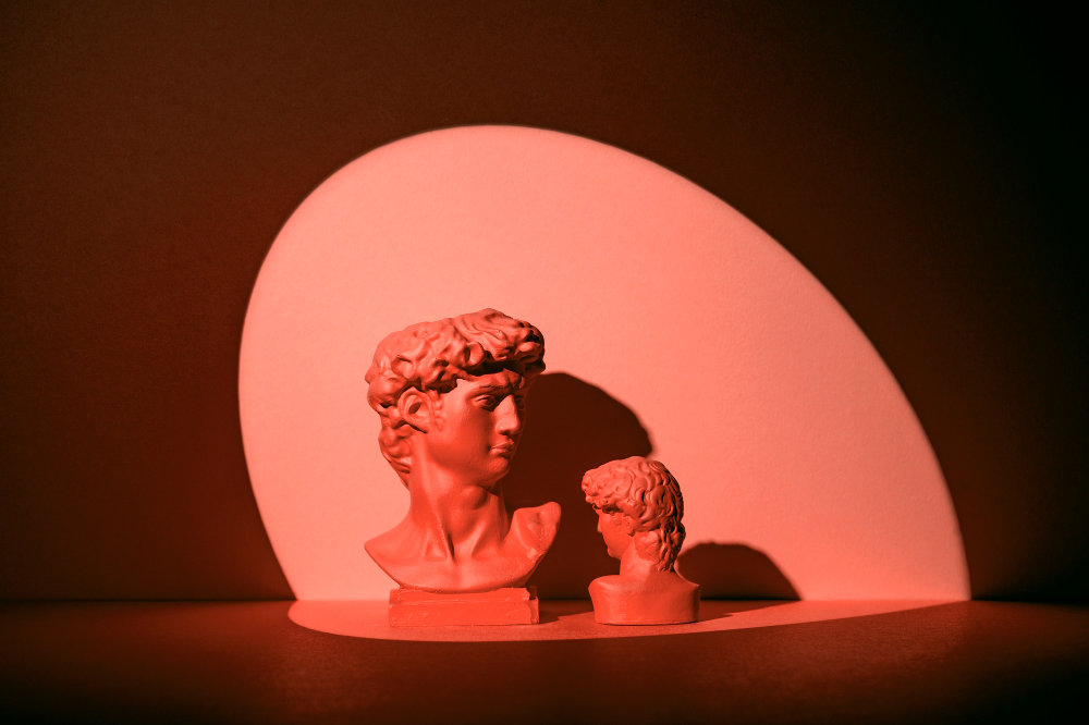 Greek bust in red alluding to love
