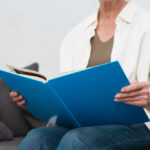 woman holding manual book