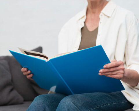 woman holding manual book