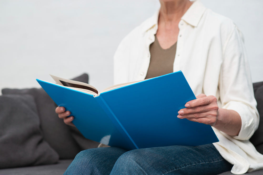 woman holding manual book